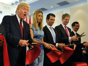 (L - R)Donald Trump and his children Ivanka, Donald Jr. and Eric participate in a ribbon-cutting ceremony during a news conference to mark the opening of the Trump International Hotel & Tower in Toronto on April 16, 2012. (REUTERS/Mike Cassese)