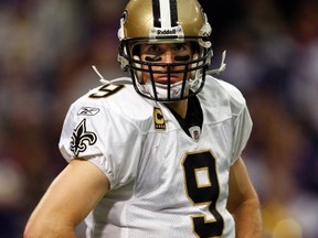 New Orleans Saints quarterback Drew Brees stands on the field as he waits for a time out to end. (Eric Miller/REUTERS)