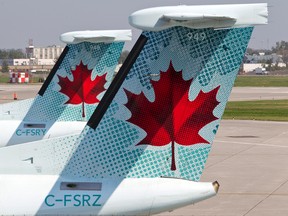 Air Canada planes are pictured in Montreal in this file photo. (JOEL LEMAY/Postmedia Network)