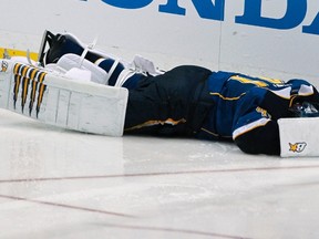 St. Louis Blues goalie Jaroslav Halak lies on the ice after teammate Barret Jackman ran into him during their NHL Western Conference quarterfinal playoff hockey game against the San Jose Sharks in St. Louis, Missouri. April 14, 2012. (REUTERS)