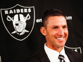Raiders' head coach Dennis Allen smiles during a news conference in Oakland, California. (REUTERS FILES/Beck Diefenbach)