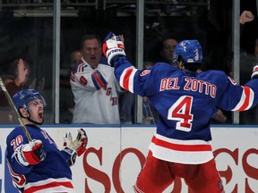 Chris Kreider celebrates his third period goal with teammate Michael Del Zotto of the New York Rangers in Game One of the Eastern Conference Semifinals against the Washington Capitals during the 2012 NHL Stanley Cup Playoffs at Madison Square Garden on April 28, 2012 in New York City. (Bruce Bennett/Getty Images/AFP)