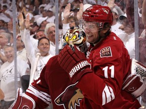 Phoenix Coyotes' Martin Hanzal celebrates with goaltender Mike Smith after Hanzal scored the game winning goal in overtime against the Chicago Blackhawks on April 12, 2012 in Glendale, Arizona. (Christian Petersen/Getty Images/AFP)