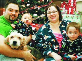 Shannon Wheaton holds his son Benjamin, wife Trena Thompson-Wheaton and son Timothy. Shannon, his wife and Benjamin were among the seven who died in the Highway 63 crash on Friday. (FACEBOOK)