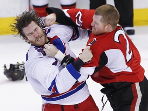 Senators forward Chris Neil fights with Rangers forward Brandon Prust fight during Game 6 of their NHL Eastern Conference quarterfinal series at Scotiabank Place in Ottawa, Ont., April 23, 2012. (ERROL McGIHON/QMI Agency)