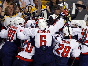 Capitals players celebrate after defeating the Bruins in overtime of Game 7 in their the NHL Eastern Conference quarterfinal series at TD Garden in Boston, Mass., April 25, 2012. (BRIAN SNYDER/Reuters)