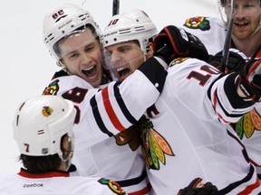 Chicago Blackhawks centre Patrick Sharp, right, is hugged by teammate Patrick Kane after scoring against the Phoenix Coyotes to tie the game with 5 seconds left in the third period during Game 2 of the NHL Western Conference quarter-final in Glendale, Ariz., on April 14. 
Darryl Webb, Reuters