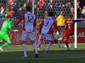 Kyle Beckerman of Real Salt Lake beats TFC netminder Milos Kocic during its 3-2 victory on Saturday night in Utah. (Getty Images)