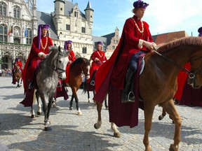 Costumed men on horseback parade through Mechelen during the annual Hanswijk procession, a tradition in the Belgian city since the 13th century.  (Courtesy Mechelen Tourism)