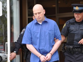 Brandon Gray, 26, is escorted from the Belleville superior court to an awaiting cruiser for his ride to a federal penitentiary. (JASON MILLER/QMI AGENCY)