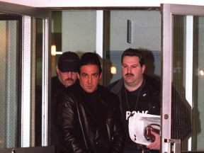 Juan Ramon Paz-Fernandez — also known as Joe Bravo — first deported in 1999, is led away by RCMPin 2001  after the mob enforcer was nabbed  in Woodbridge. (Toronto Sun files)