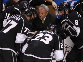 Kings head coach Darryl Sutter talks to his players during a timeout against the Canucks in Game 4 of their NHL Western Conference quarterfinal series at the Staples Center in Los Angeles, Calif.,  April 18, 2012. (DANNY MOLOSHOK/Reuters)