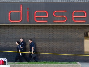 Forensics officers investigate the scene of a suspicious death at the Diesel Ultra Lounge in Edmonton, Alberta on Sunday, May 6, 2012.  AMBER BRACKEN/EDMONTON SUN/QMI AGENCY