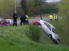 An injured woman was stuck in her car overnight after this crash on Stagecoach Rd. in south Ottawa. Crews were called to rescue the victim shortly after 8 a.m., Thursday, May 11, 2012. (TONY SPEARS Ottawa Sun)