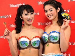 Triumph International Japan campaign models display the "Super Cool Bra" at the company's headquarters in Tokyo on May 9, 2012. (AFP PHOTO/Yoshikazu TSUNO)
