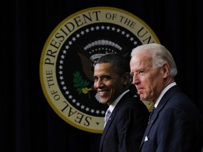 U.S. President Barack Obama and Vice President Joe Biden smile after Obama delivered remarks on the extension of the payroll tax cut and unemployment insurance in the Old Executive Office Building in Washington February 21, 2012.  (REUTERS/Jason Reed)