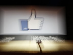 A Facebook Like Button logo is seen at the entrance of the Facebook headquarters in Menlo Park on May 10, 2012 in California. (AFP/Kimihiro Hoshino)