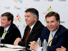 From left to right, Federal Finance Minister Jim Flaherty; Charles Sousa, the Ontario minister responsible for the Pan/Parapan American Games; and Ian Troop, CEO of TO2015 update the media on the progress of the Pan Am Games  on Friday. (Veronica Henri/Toronto Sun)