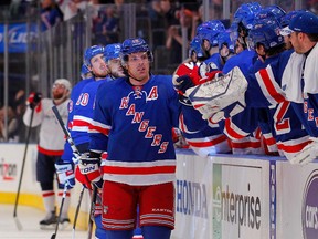 Rangers' Brad Richards celebrates with teammates on the bench after he scored a goal n the first period against the Washington Capitals. (Paul Bereswill/Getty Images/AFP)