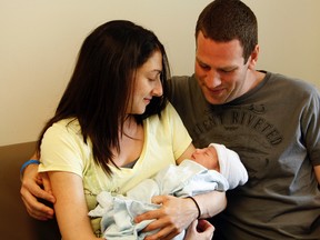 Jody and Steve Shaffer with their newborn, Jordan Sophie. (DAVE ABEL, Toronto Sun)