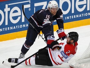 Joey Crabb (left) of the U.S. collides with Canada's Duncan Keith during round robin play at the world hockey championship in Helsinki. (Grigory Dukor/Reuters)