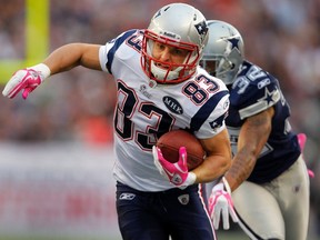 New England Patriots' wide receiver Wes Welker is pushed out of bounds by Dallas Cowboys' cornerback Orlando Scandrick during the first quarter of their NFL football game in Foxborough, Massachusetts October 16, 2011. (REUTERS/Adam Hunger)