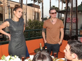 Jennifer Lopez and Casper Smart attend the Planet Dailies And Mixology 101 Grand Opening in Los Angeles.  Christopher Polk/Getty Images for Mixology 101/AFP