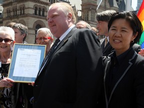 Councillor Kristyn Wong-Tam at the PFLAG flag-raising ceremony in Nathan Phillips Square Thursday with surprise attendee, Mayor Rob Ford in 2013. (Veronica Henri/Toronto Sun files)