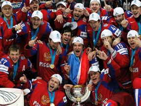 Team Russia poses for a photo after defeating Slovakia in the IIHF World Championships gold-medal game in Helsinki, Finland, May 20, 2012. (PETR JOSEK/Reuters)