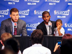 Blake Griffin (left) and Chris Paul of the Los Angeles Clippers answer questions following their team's loss to the San Antonio Spurs in Game 4 of the Western Conference semifinals on Sunday. (Getty Images)