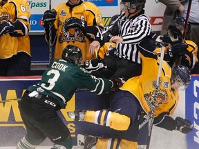 Shawinigan Cataractes forward Alexandre Grand-Maison is hit by London Knights defenceman Brett Cook during their Memorial Cup match in Shawinigan, Que., May 20, 2012. (MATHIEU BELANGER/Reuters)