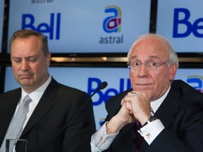 Bell Canada Enterprises (BCE) President and CEO George Cope (L) and Astral Media Inc. President and CEO Ian Greenberg attend a news conference in Montreal March 16, 2012. REUTERS/Christinne Muschi