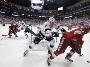 Kyle Chipchura of the Coyotes cycling the puck against Kings' Matt Greene behind the L.A. net doesn't turn Beezer's crank for exciting playoff hockey.(Reuters)