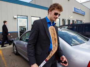 Edmonton Oil Kings goaltender Laurent Brossoit holds an autographed souvenir after arriving back in Edmonton on Friday. The Oil Kings were eliminated at the Memorial Cup by the Shawinigan Cataractes on Thursday.
Amber Bracken, Edmonton Sun