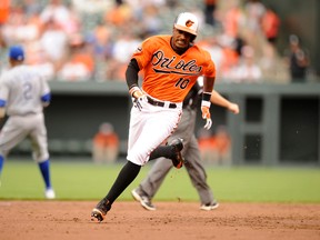 Adam Jones of the Baltimore Orioles runs to third base in the third inning on May 26, 2012 in Baltimore, Maryland. (Mitchell Layton/Getty Images/AFP)