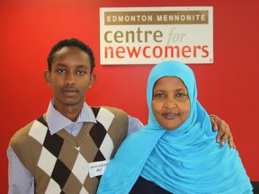 Abdulrashid Ali poses with his mom, Halimo Warsame, at the Edmonton Mennonite Centre for Newcomers Tuesday, where Ali was honoured with a RISE Youth Achievement Award. KEVIN MAIMANN/EDMONTON SUN/QMI AGENCY