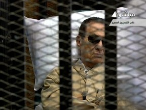 An image grab taken from Egyptian state TV shows ousted Egyptian president Hosni Mubarak sitting inside a cage in a courtroom during his verdict hearing in Cairo on June 2, 2012. (AFP PHOTO/EGYPTIAN TV)