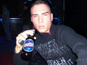 Suspected killer Luka Magnotta is seen drinking a Labatt Beer in this Facebook photo.