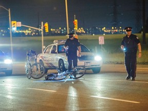 Officers investigate after a motorist allegedly hit a police officer on a bike and took off. (VICTOR BIRO PHOTO)