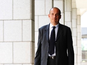 Former Olympus chief executive Michael Woodford leaves the East London Tribunal Service in east London May 28, 2012. REUTERS/Luke MacGregor