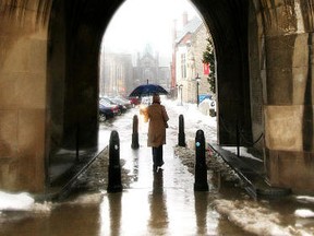 A pedestrian walks though the University of Toronto campus in downtown Toronto. (QMI AGENCY PHOTO)