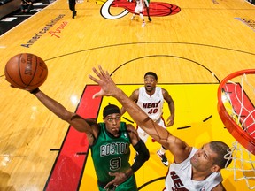 Celtics’ Rajon Rondo shoots the ball over the Heat’s Shane Battier during Miami’s overtime win in Game 2. Battier said of Rondo’s 44-point, eight-rebound, 10-assist game:  “He almost single-handedly best us.”