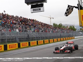 Jenson Button wins the Canadian Grand Prix at Circuit Gilles Villeneuve in Montreal last year. (Chris Wattie/Reuters)