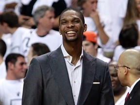 Chris Bosh, out of the Heat lineup with an injury, stands on the sideline before Game 1 of the Eastern Conference final in Miami on May 28, 2012. (Andrew Innerarity/Reuters)