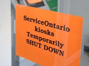 W. BRICE MCVICAR The Intelligencer
Signs are posted to the door and the Service Ontario kiosk at Century Place in Belleville informing residents the machine is down for a temporary basis. All machines across Ontario have been shut down by the province after security concerns.