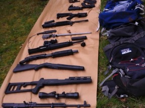 Weapons taken from a mountainside bunker where King County Police found the body, thought to be that of suspect Peter Keller,after blasting a hole in the roof of the heavily fortified bunker near North Bend, Washington are seen in this handout photo obtained by Reuters April 28, 2012. Discovery of the body ended a siege of the bunker hidden in dense woods about 30 miles east of Seattle, Washington, that began on Friday and involved scores of officers.  REUTERS/King County Sheriff's Office/Handout  (UNITED STATES - Tags: CRIME LAW) FOR EDITORIAL USE ONLY. NOT FOR SALE FOR MARKETING OR ADVERTISING CAMPAIGNS. THIS IMAGE HAS BEEN SUPPLIED BY A THIRD PARTY. IT IS DISTRIBUTED, EXACTLY AS RECEIVED BY REUTERS, AS A SERVICE TO CLIENTS