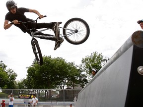 Billy Brown, 23, gets some air during the unveiling of a set of new metal BMX ramps at the Wallace Emerson Park (LAURA PEDERSEN/TORONTO SUN/QMI AGENCY).