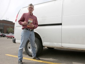 Jeff Howard stands with a map of the Yukon beside the van he lives in. Howard is a survivalist who created a group on meetup.com in hopes of gathering a group to prepare for economic and social collapse. CATHERINE GRIWKOWSKY/ EDMONTON SUN/ QMI AGENCY