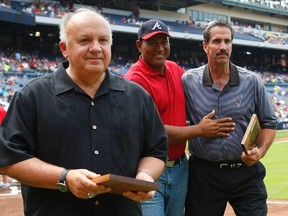 Former Atlanta Braves players Sid Bream and Francisco Cabrera, along with former MLB umpire Randy Marsh leave the field following a pre-game ceremony honoring the 20th anniversary of Bream's famous slide that sent the Braves to the 1992 World Series. (Tami Chappell/REUTERS)