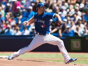 Jays starting pitcher Kyle Drabek had to leave the game in the fifth inning following an undisclosed injury on Wednesday. (Mark Blinch/Reuters)